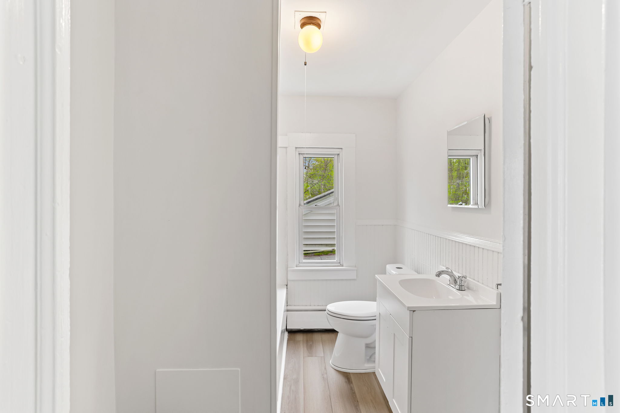 63 Reynolds Street, Unit B Killingly, CT 06239 - Photo 15 of 32 a bathroom with a sink and a mirror