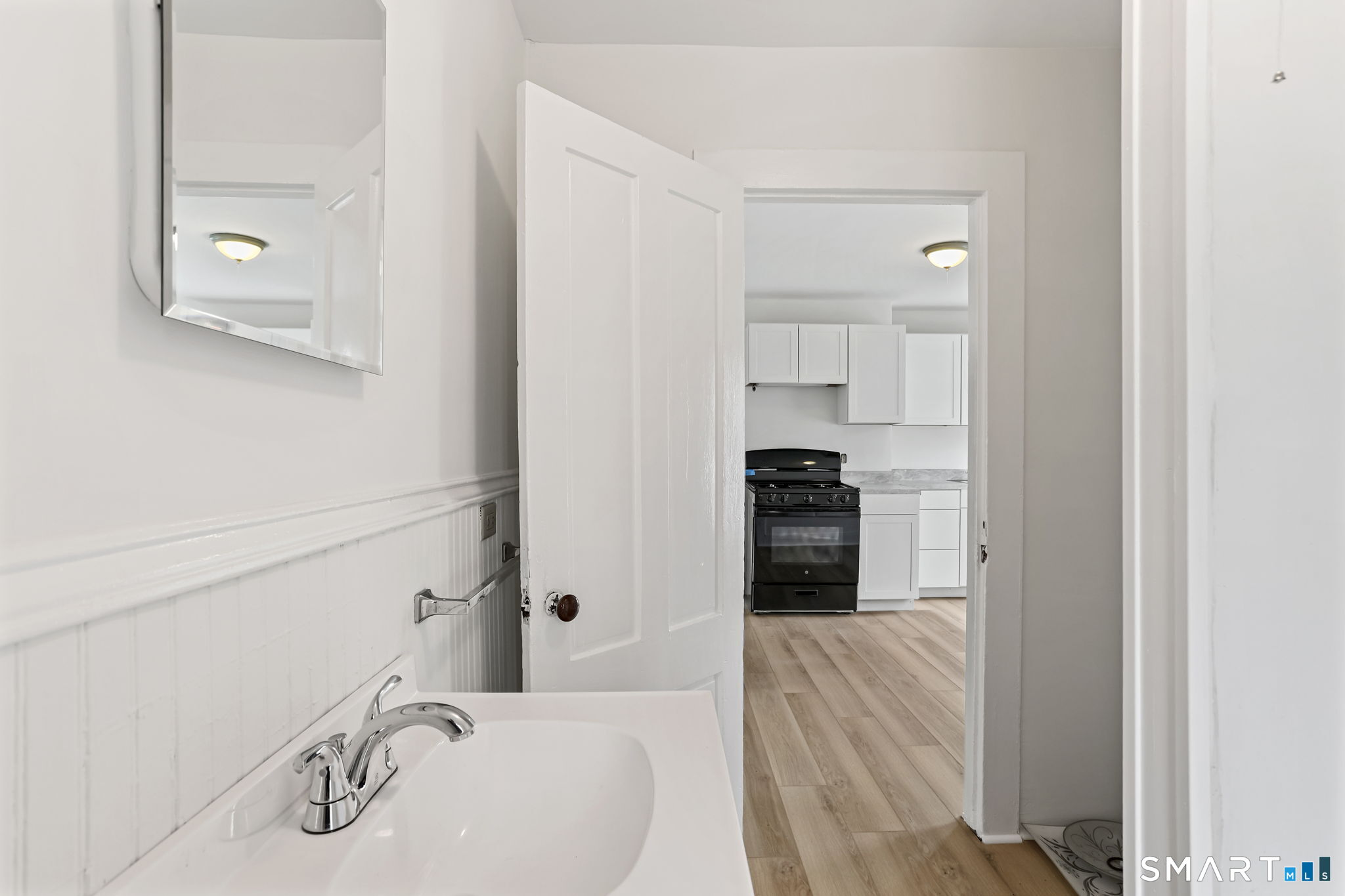 63 Reynolds Street, Unit B Killingly, CT 06239 - Photo 16 of 32 a bathroom with a sink and a mirror