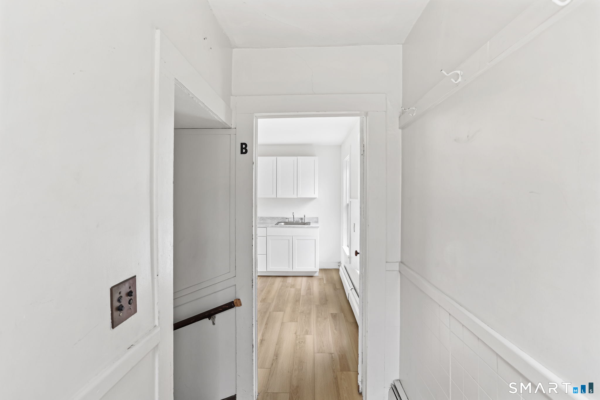63 Reynolds Street, Unit B Killingly, CT 06239 - Photo 17 of 32 a view of a hallway with wooden floor