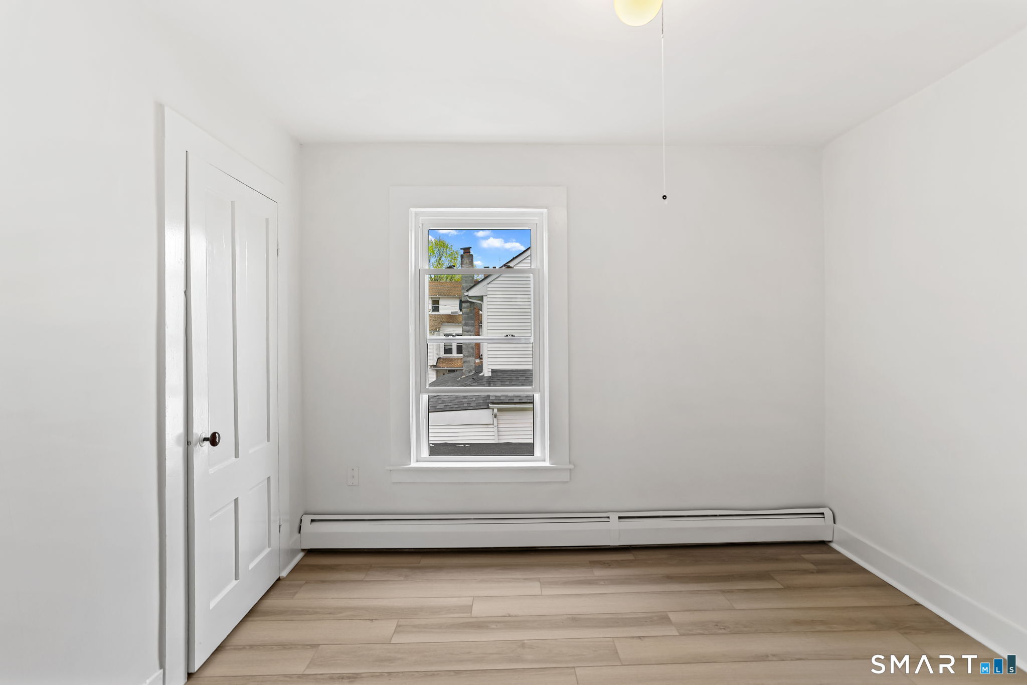 63 Reynolds Street, Unit B Killingly, CT 06239 - Photo 7 of 32 a view of an empty room with a window