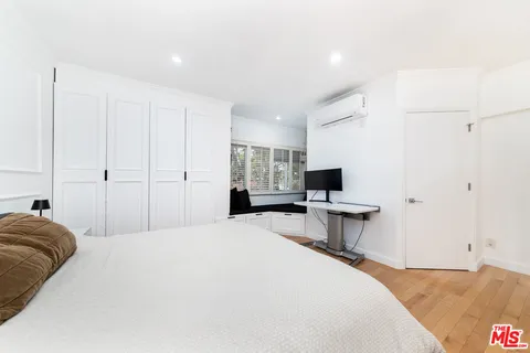 a bedroom with a bed and furniture