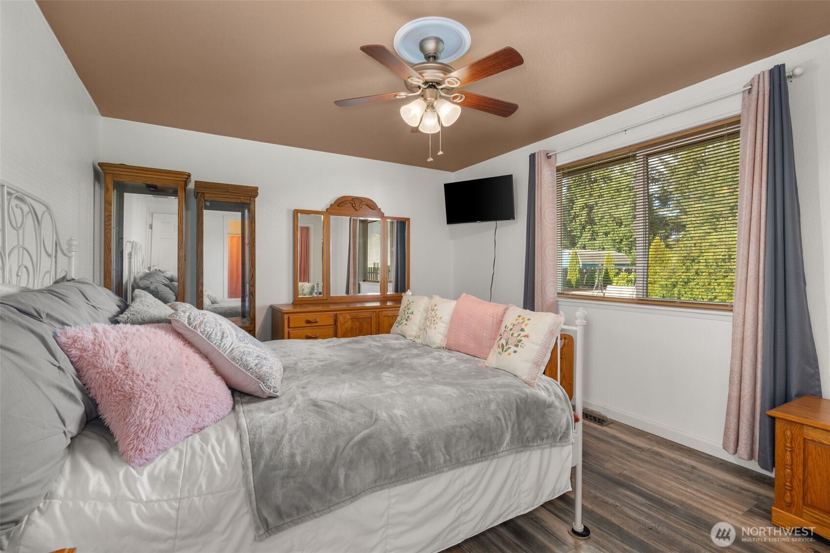 5916 187th Lane Southwest Rochester, WA 98579 - Photo 12 of 39 a bedroom with a large bed and a large window