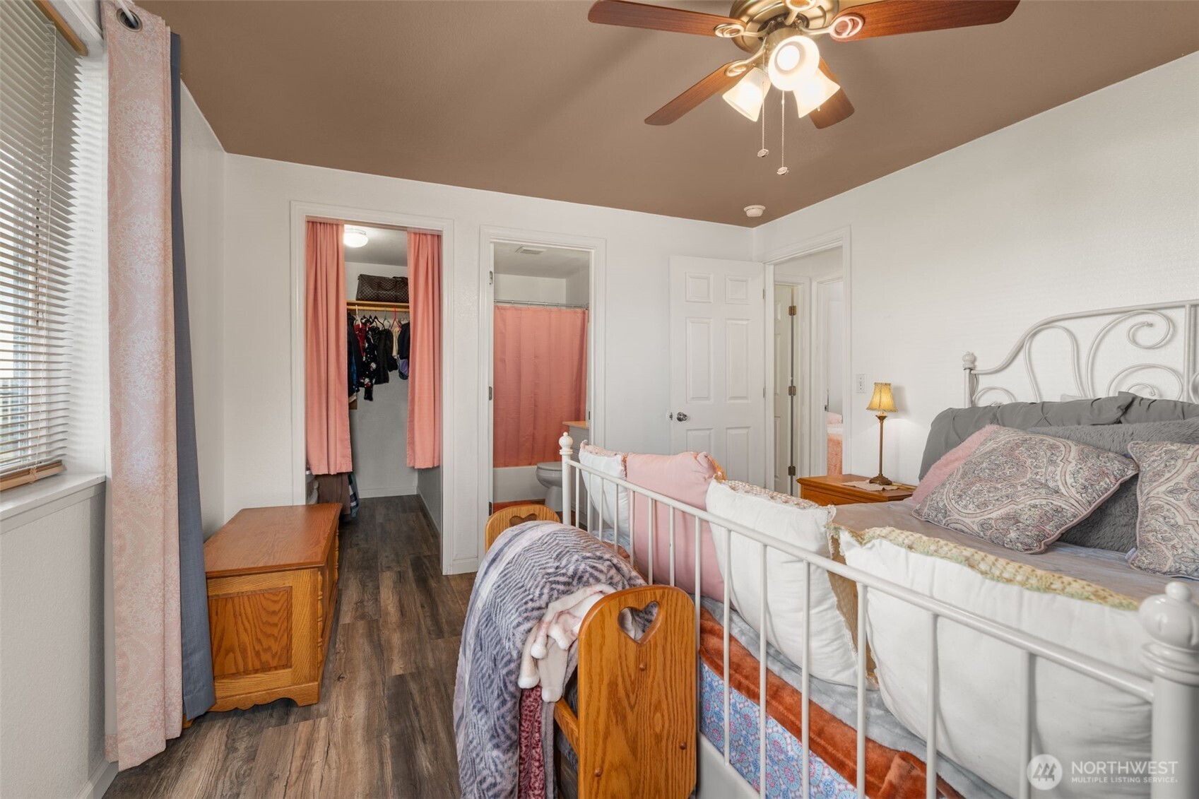 5916 187th Lane Southwest Rochester, WA 98579 - Photo 13 of 39 a bedroom with a bed and a chandelier