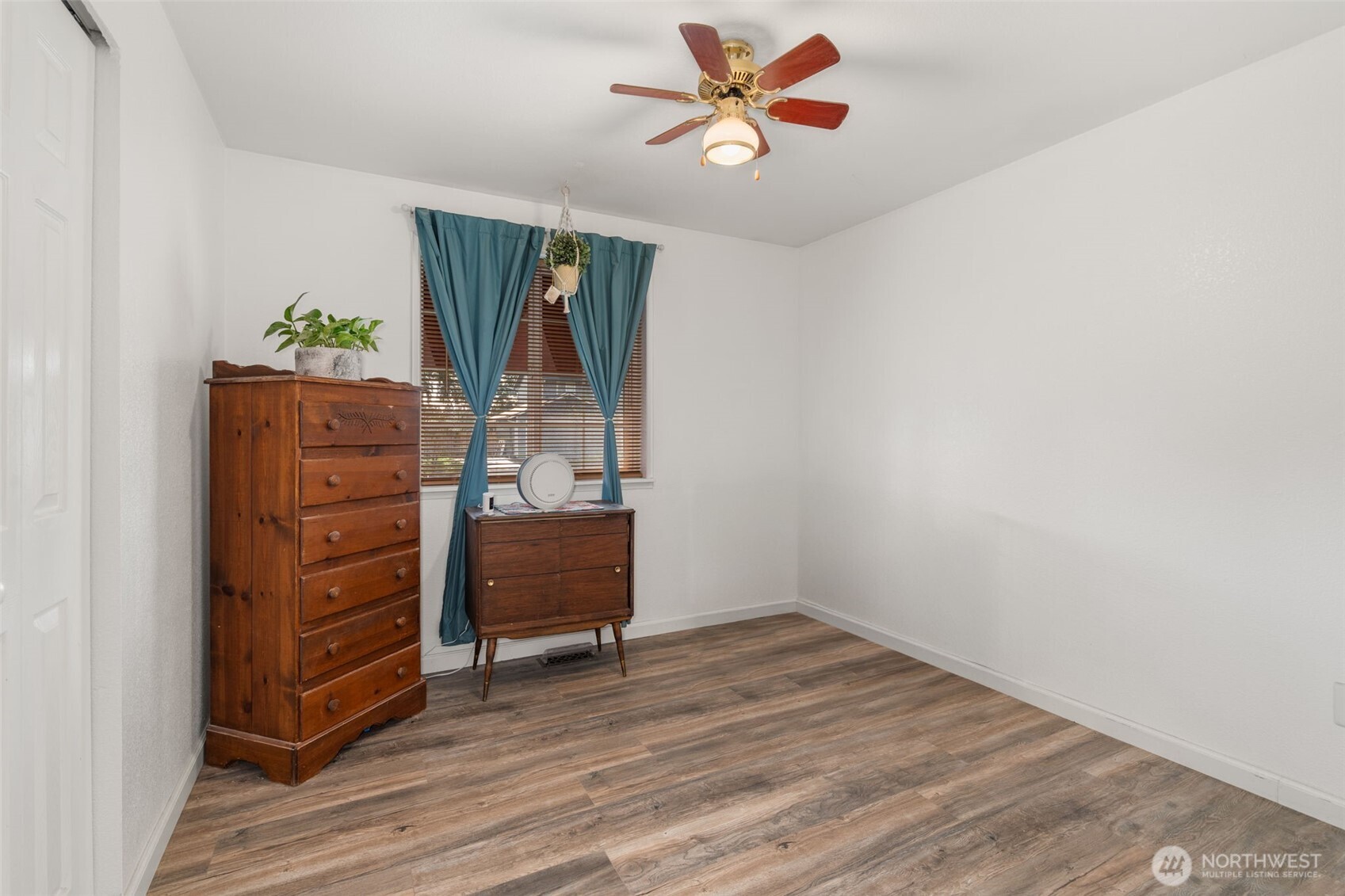 5916 187th Lane Southwest Rochester, WA 98579 - Photo 17 of 39 a view of a workspace with furniture and wooden floor