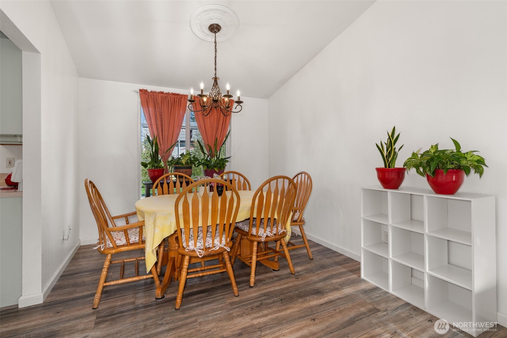 5916 187th Lane Southwest Rochester, WA 98579 - Photo 10 of 39 a view of a dining room with furniture wooden floor and chandelier