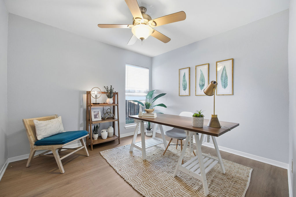 6486 Hart Lane Austin, TX 78731 - Photo 17 of 28 Office area with wood finished floors and ceiling fan