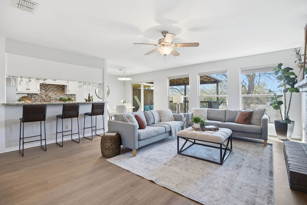 6486 Hart Lane Austin, TX 78731 - Photo 2 of 28 Living area featuring light wood-style flooring and a ceiling fan