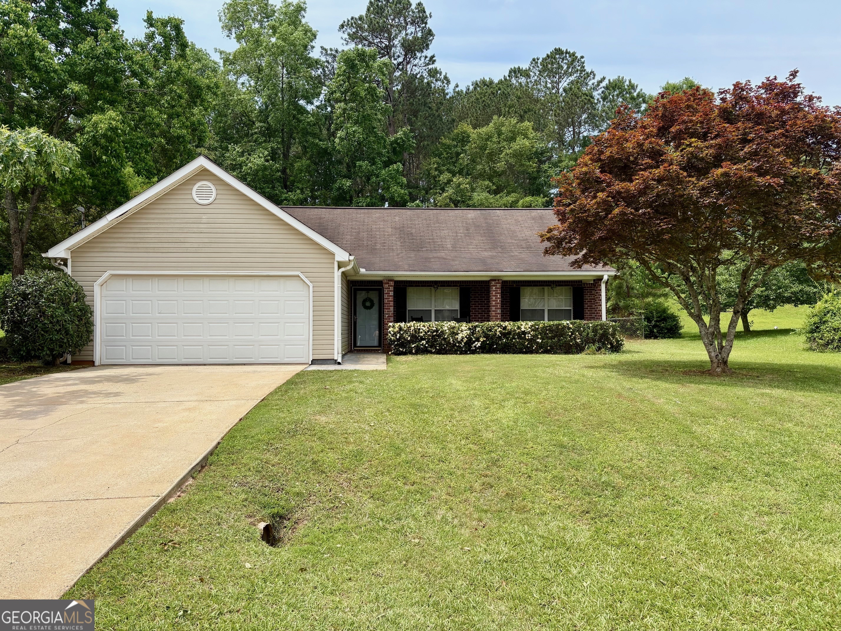 344 Autumn Ridge Trail Gray, GA 31032 - Photo 1 of 1 a front view of house with yard and trees