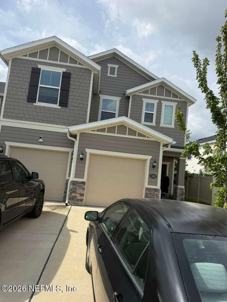 11865 Junegrass Road Jacksonville, FL 32258 - Photo 15 of 17 a car parked in front of a house