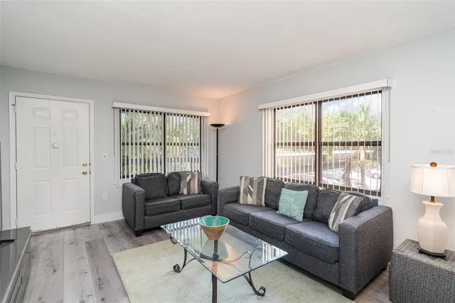 a living room with furniture and a large window
