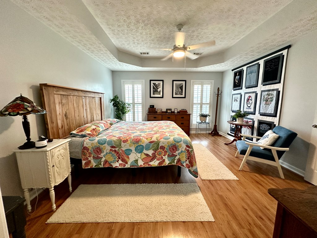 8013 Silverado Drive Columbus, GA 31909 - Photo 26 of 47 a bedroom with a bed wooden floor and window