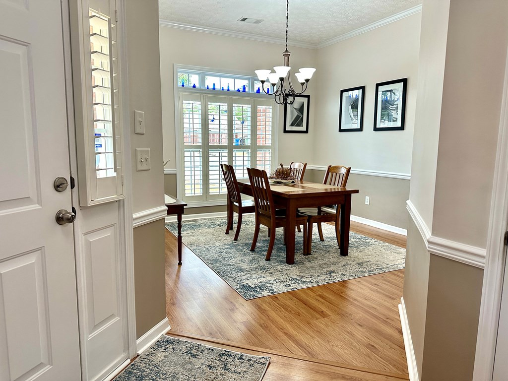 8013 Silverado Drive Columbus, GA 31909 - Photo 3 of 47 a view of a dining room with furniture and chandelier