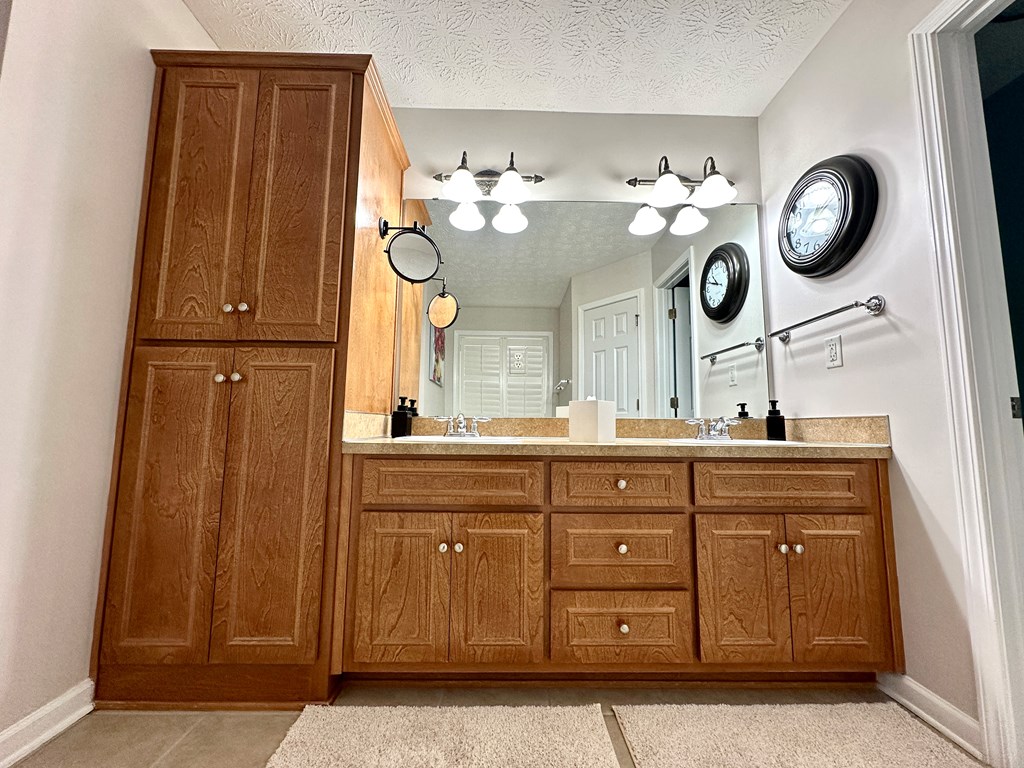 8013 Silverado Drive Columbus, GA 31909 - Photo 32 of 47 a bathroom with a sink and a mirror
