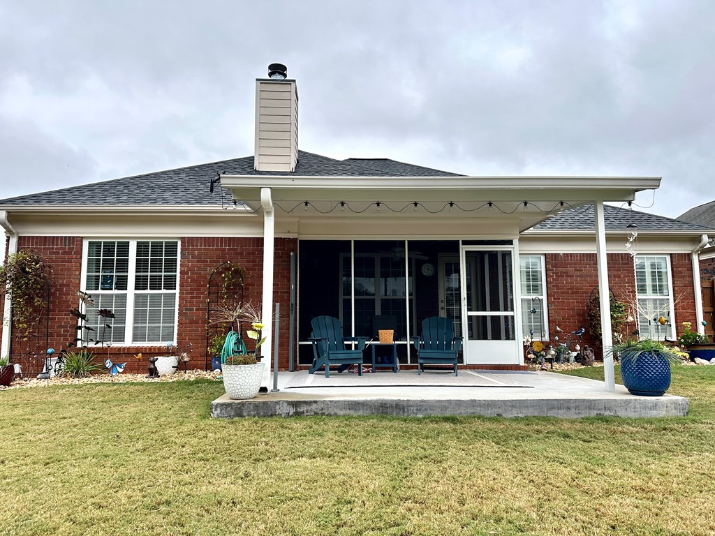 8013 Silverado Drive Columbus, GA 31909 - Photo 42 of 47 a view of a house with sitting area and garden