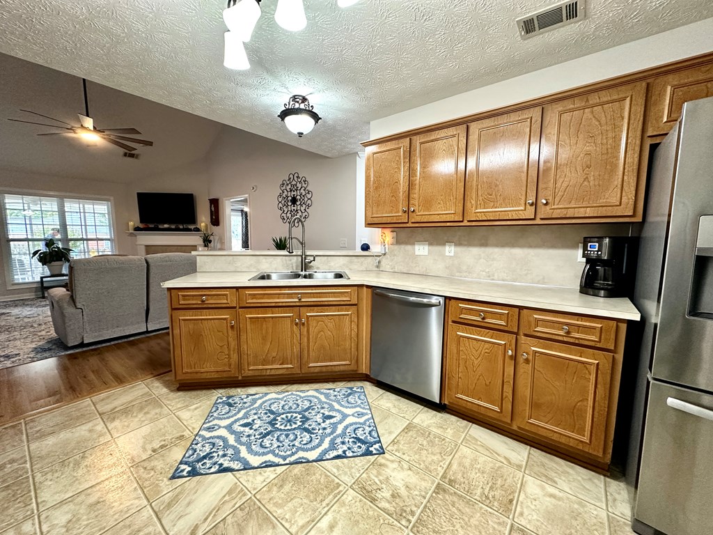 8013 Silverado Drive Columbus, GA 31909 - Photo 10 of 47 a kitchen with a sink stove and refrigerator