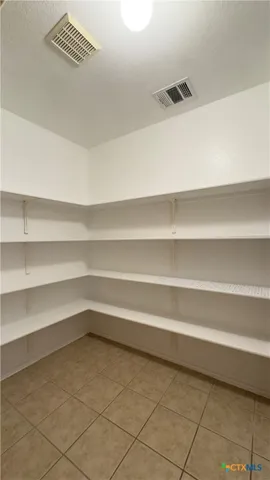 a storage room with washer and dryer