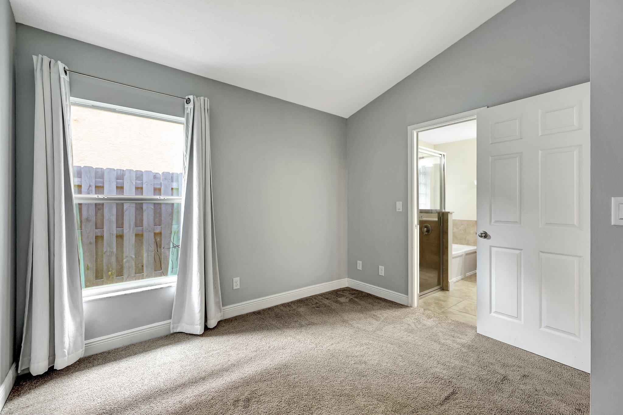 9331 Breakers Row Fort Pierce, FL 34945 - Photo 22 of 39 a view of an empty room with a window