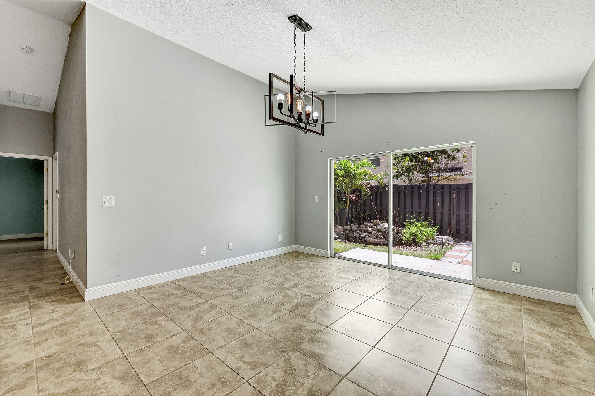 9331 Breakers Row Fort Pierce, FL 34945 - Photo 7 of 39 a view of an entryway with wooden floor