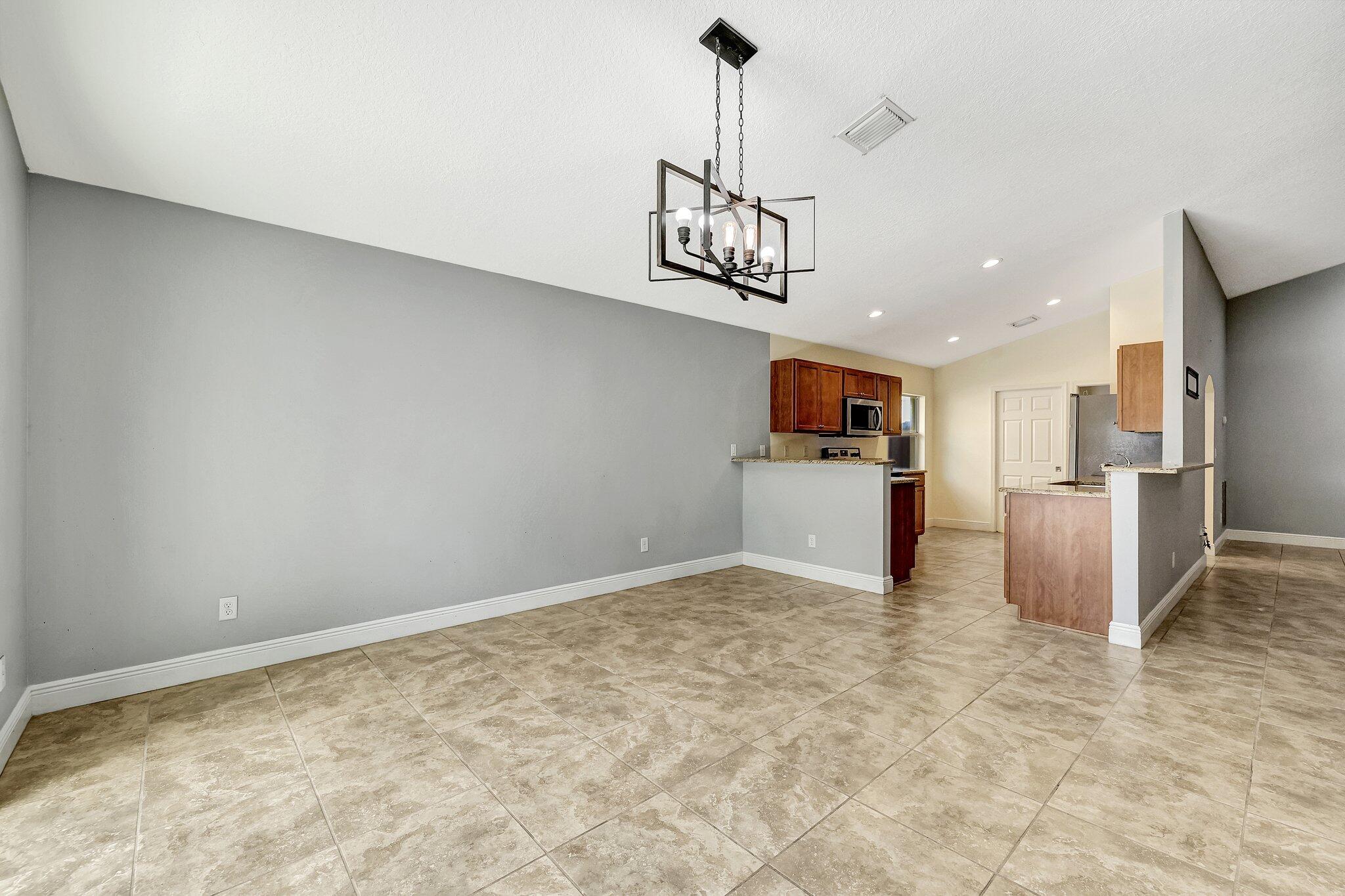 9331 Breakers Row Fort Pierce, FL 34945 - Photo 8 of 39 a view of a kitchen with a sink