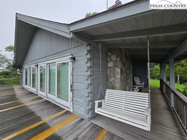 a view of a two chairs in the balcony