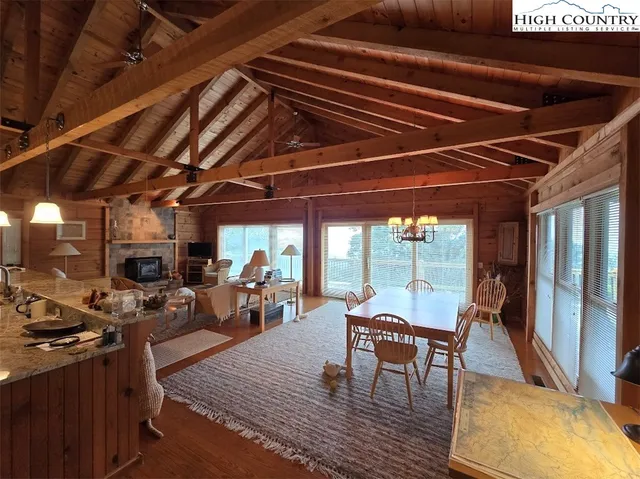 a view of a patio with table and chairs