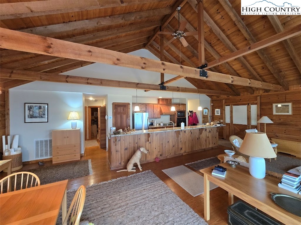 979 Wagon Road Warrensville, NC 28693 - Photo 14 of 50 a living room with furniture and wooden floor