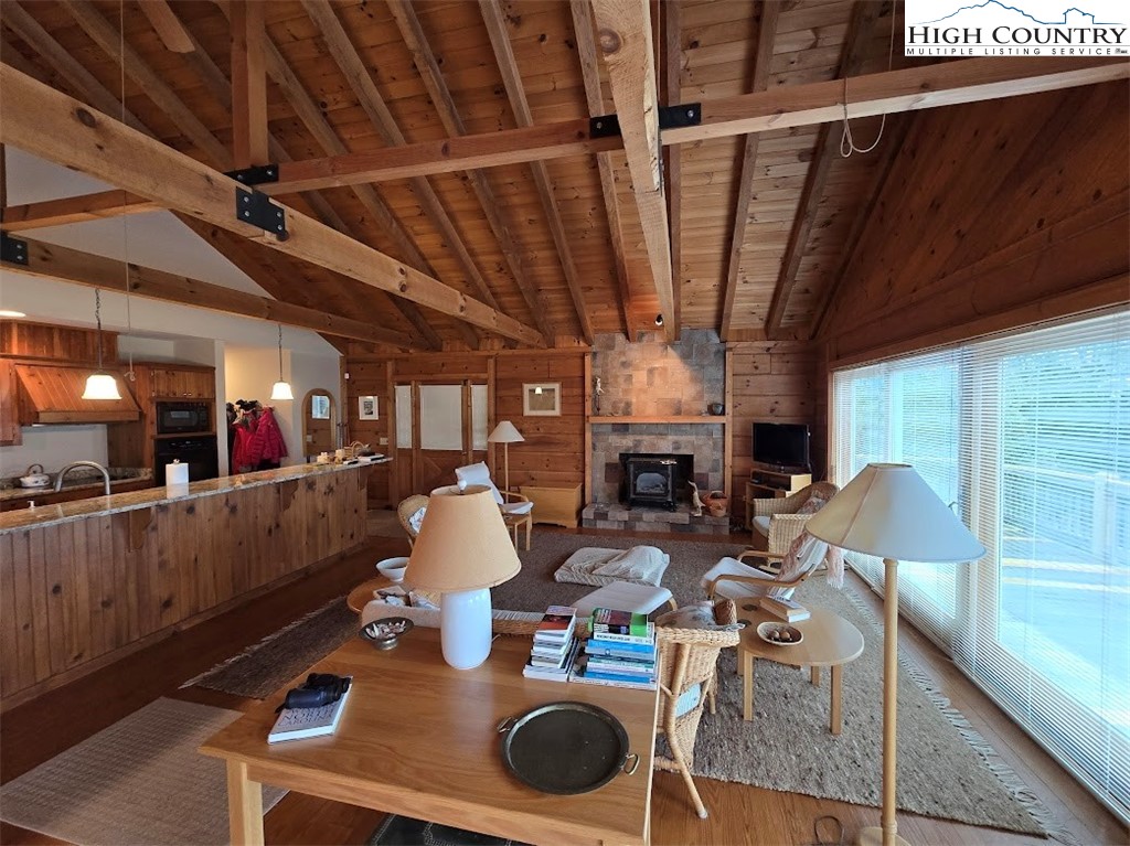 979 Wagon Road Warrensville, NC 28693 - Photo 15 of 50 a living room with furniture and a fireplace
