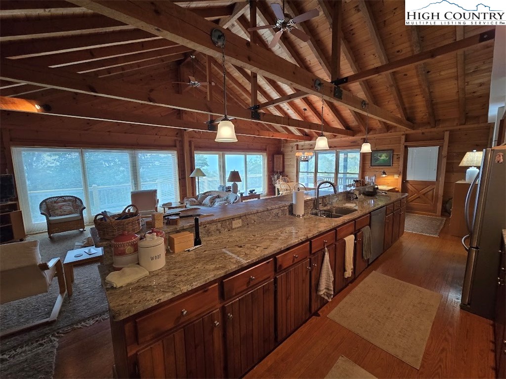 979 Wagon Road Warrensville, NC 28693 - Photo 19 of 50 a kitchen with stainless steel appliances granite countertop lots of counter top space