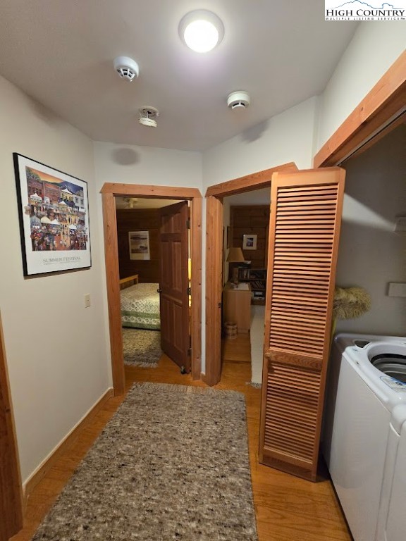 979 Wagon Road Warrensville, NC 28693 - Photo 24 of 50 a view of a hallway with bathroom and wooden floor