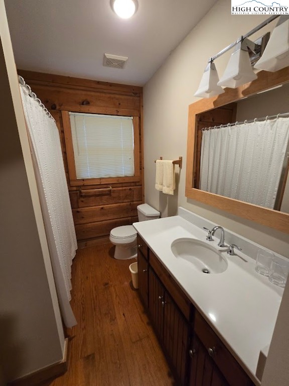 979 Wagon Road Warrensville, NC 28693 - Photo 25 of 50 a bathroom with a sink a toilet and a mirror