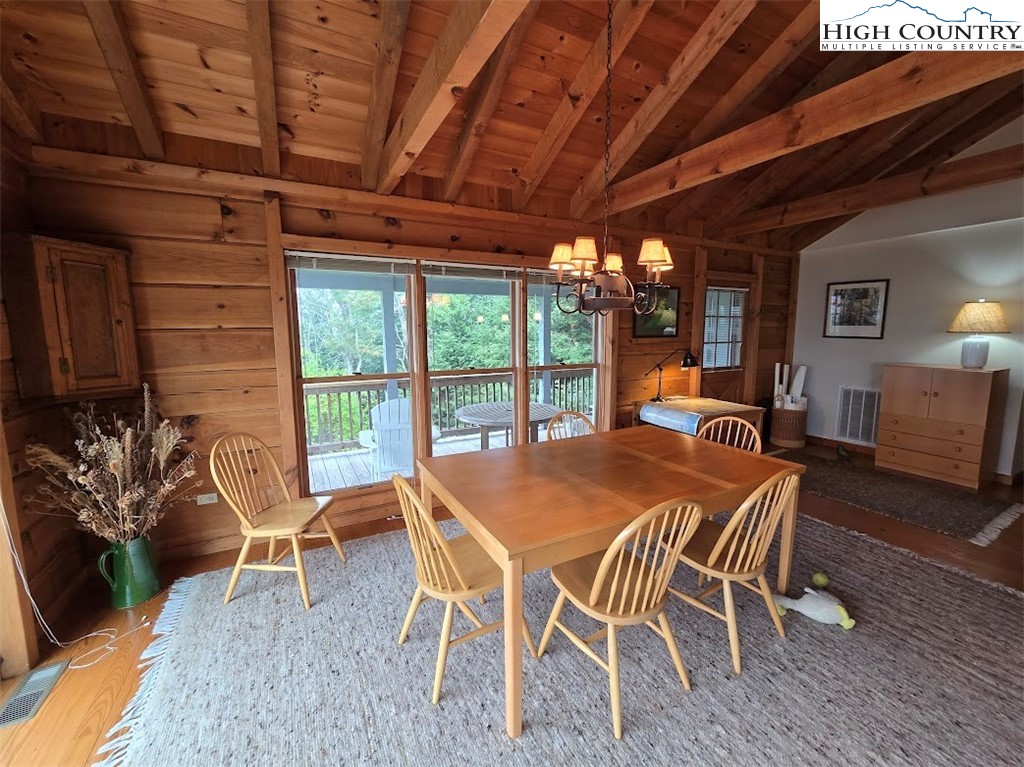 979 Wagon Road Warrensville, NC 28693 - Photo 32 of 50 a view of a dining room with furniture window and outside view