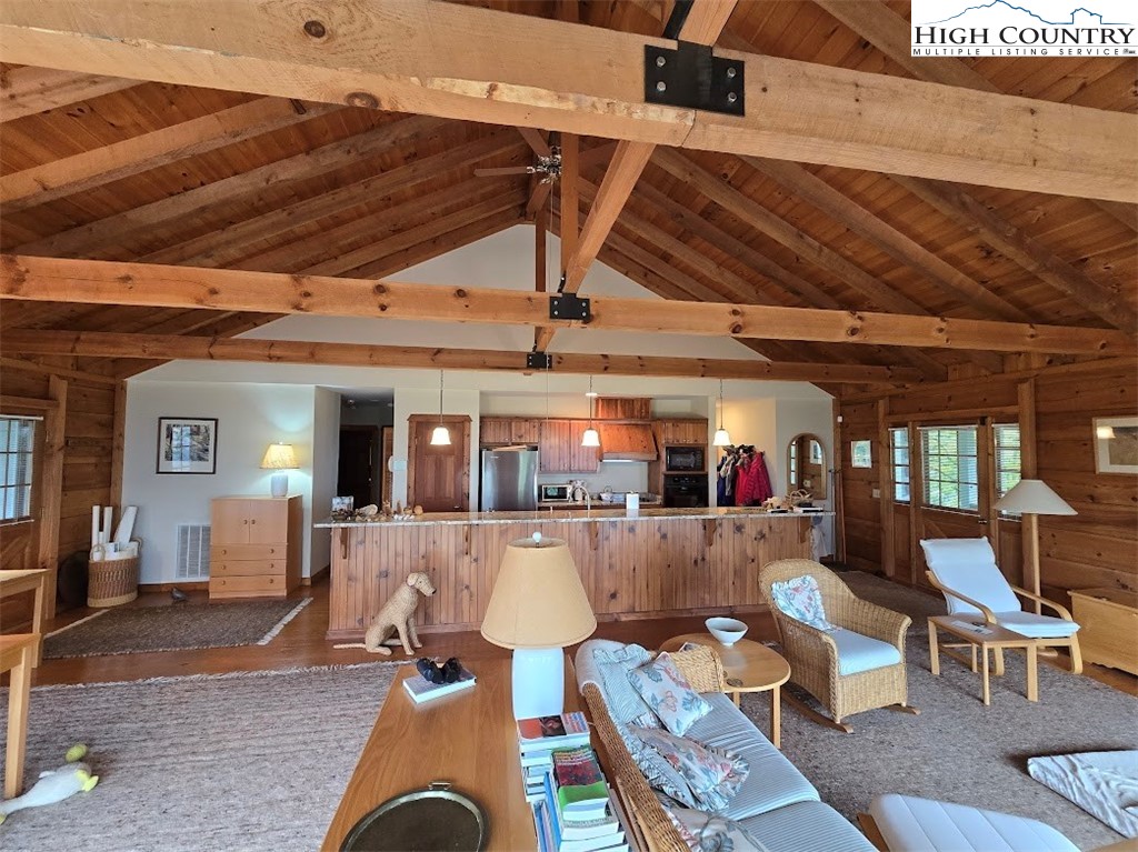 979 Wagon Road Warrensville, NC 28693 - Photo 33 of 50 a living room with furniture and wooden floors