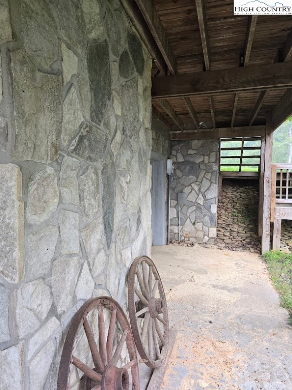 979 Wagon Road Warrensville, NC 28693 - Photo 42 of 50 a view of porch with a table and chairs