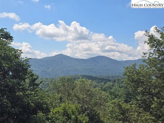 a view of a house in a field