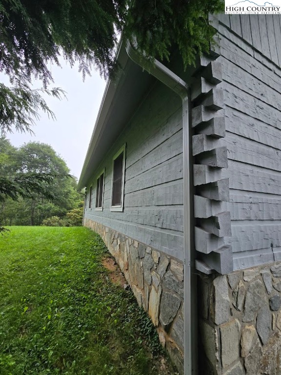 979 Wagon Road Warrensville, NC 28693 - Photo 10 of 50 a front view of a house with a yard