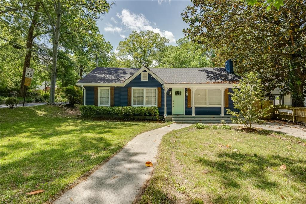 1946 Baker Road Northwest Atlanta, GA 30318 - Photo 1 of 1 a front view of a house with a garden