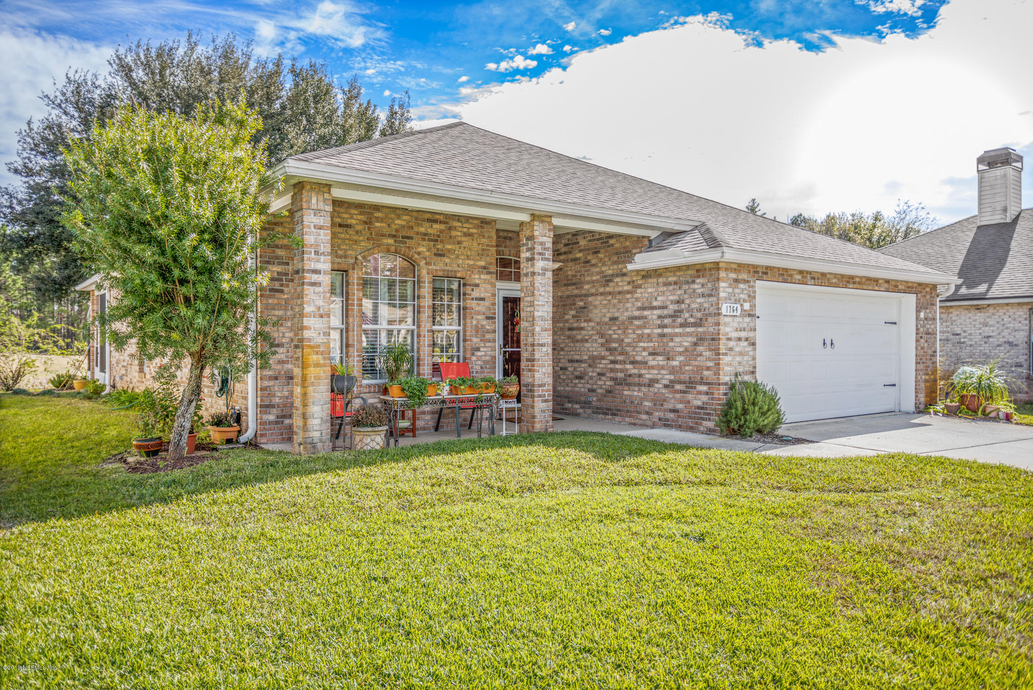1764 Keswick Road St. Augustine, FL 32084 - Photo 1 of 20 a view of a house with a yard and garage