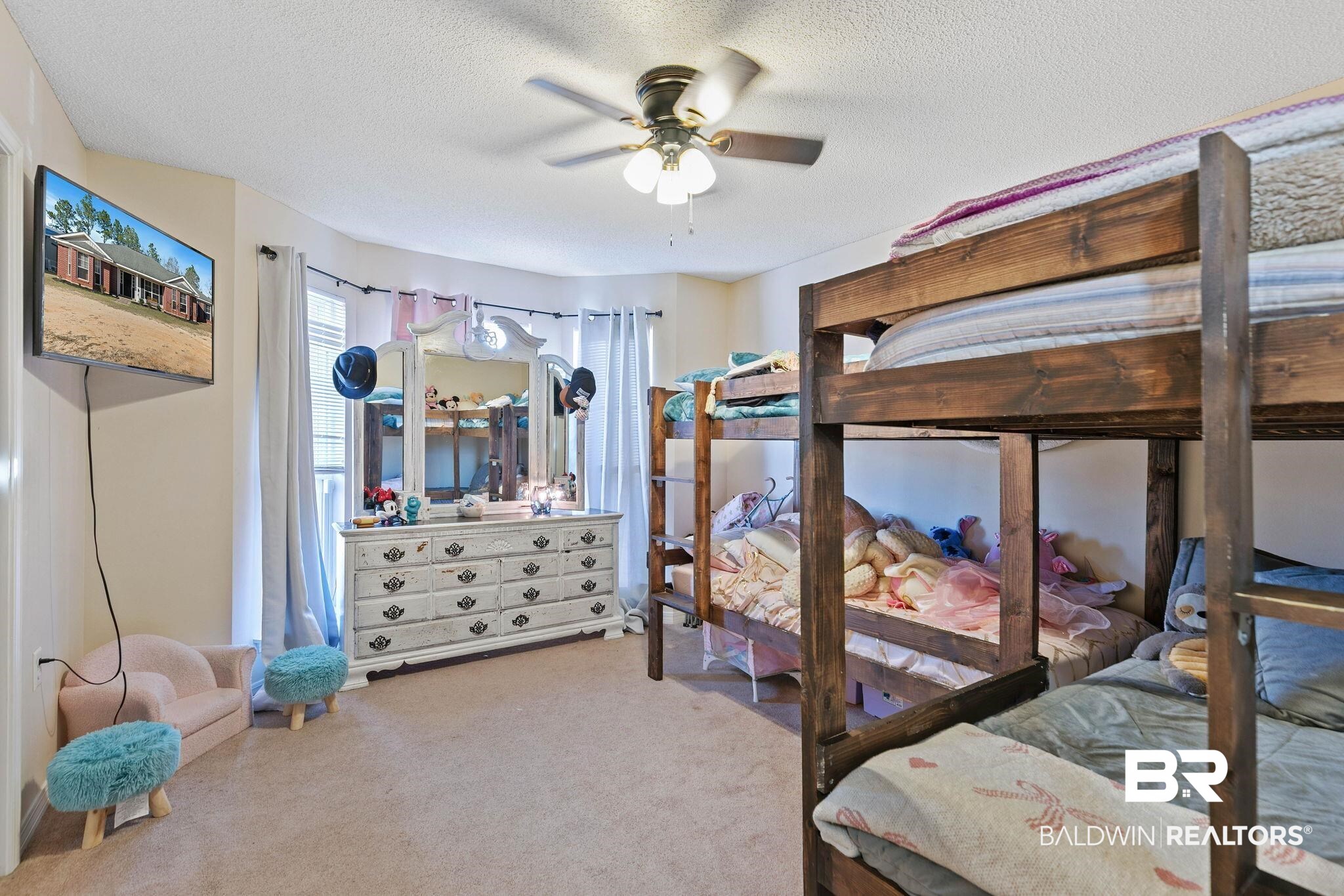 55750 Lottie Road Perdido, AL 36562 - Photo 44 of 84 Bedroom featuring carpet flooring, a ceiling fan, and a textured ceiling