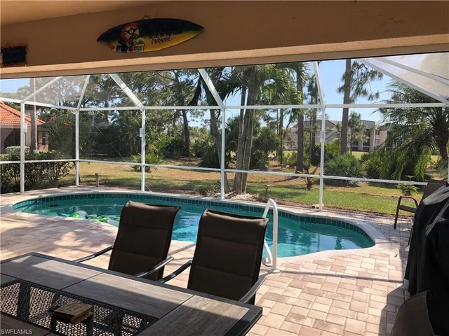 a view of swimming pool with a patio