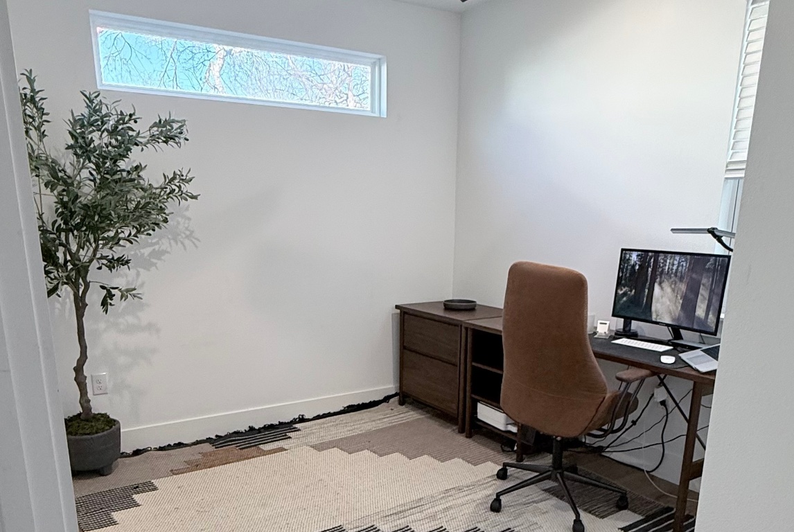 6100 Ponca Street, Unit 2 Austin, TX 78741 - Photo 11 of 17 Flexible third bedroom, located on main level—ideal as a home office, guest room, or studio.