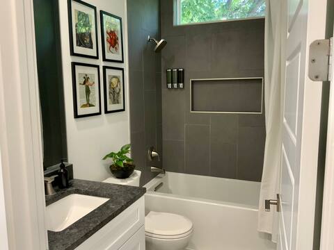 6100 Ponca Street, Unit 2 Austin, TX 78741 - Photo 12 of 17 a bathroom with a granite countertop sink toilet and shower
