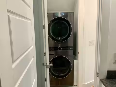 6100 Ponca Street, Unit 2 Austin, TX 78741 - Photo 13 of 17 a view of a hallway with washer and dryer