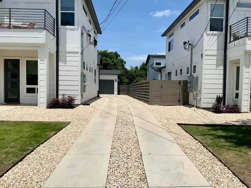 6100 Ponca Street, Unit 2 Austin, TX 78741 - Photo 17 of 17 a view of a patio with a table and chairs next to a yard