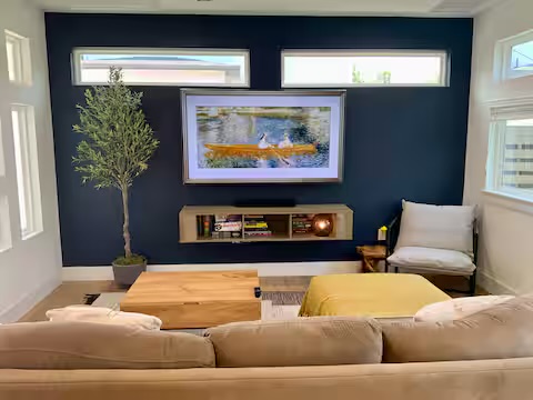 6100 Ponca Street, Unit 2 Austin, TX 78741 - Photo 3 of 17 a living room with furniture and a flat screen tv