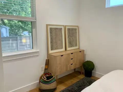 a bathroom with a toilet and a window