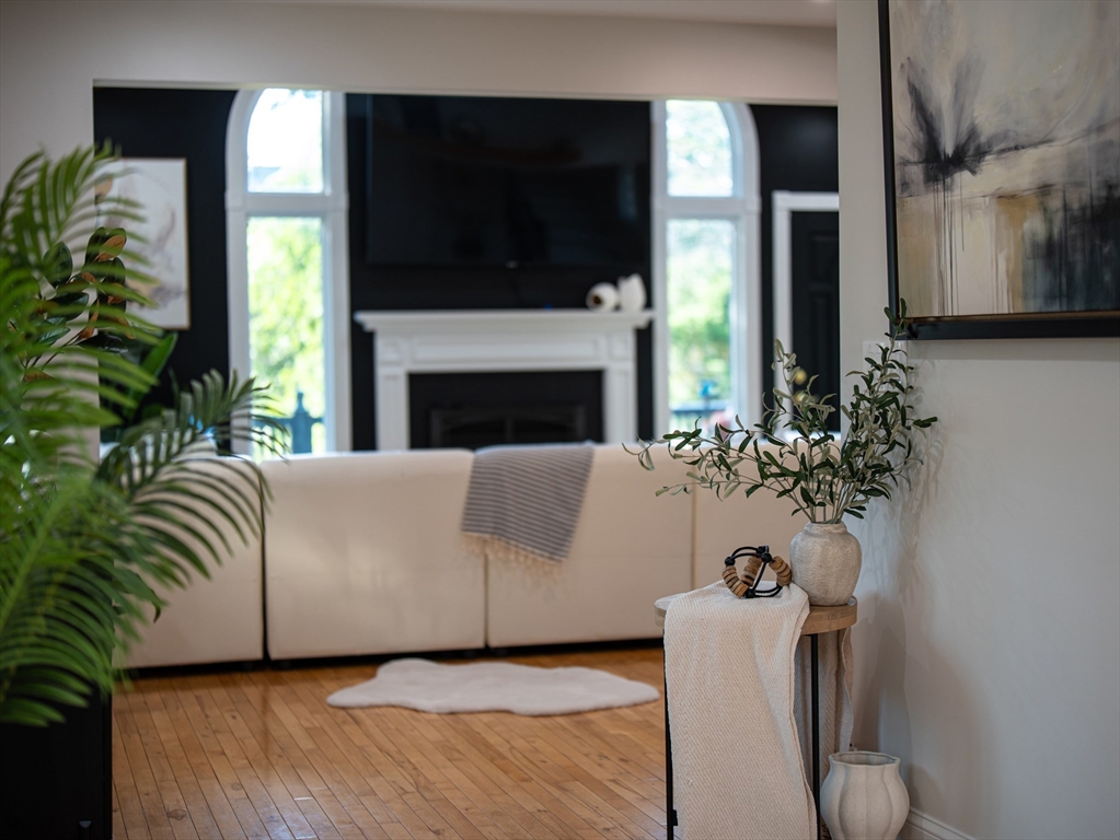 24 Miller Road Wilmington, MA 01887 - Photo 16 of 40 a living room with furniture fireplace and flat screen tv