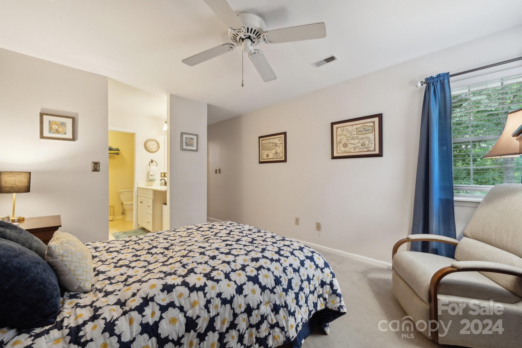 9012 St Thomas Lane Charlotte, NC 28277 - Photo 18 of 25 a bedroom with a bed couch and window