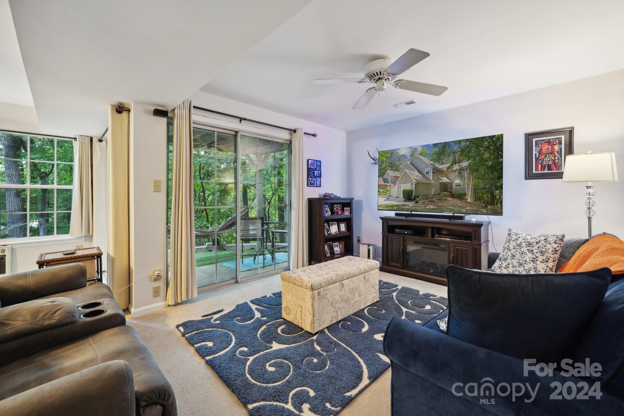 9012 St Thomas Lane Charlotte, NC 28277 - Photo 20 of 25 a living room with furniture and a flat screen tv
