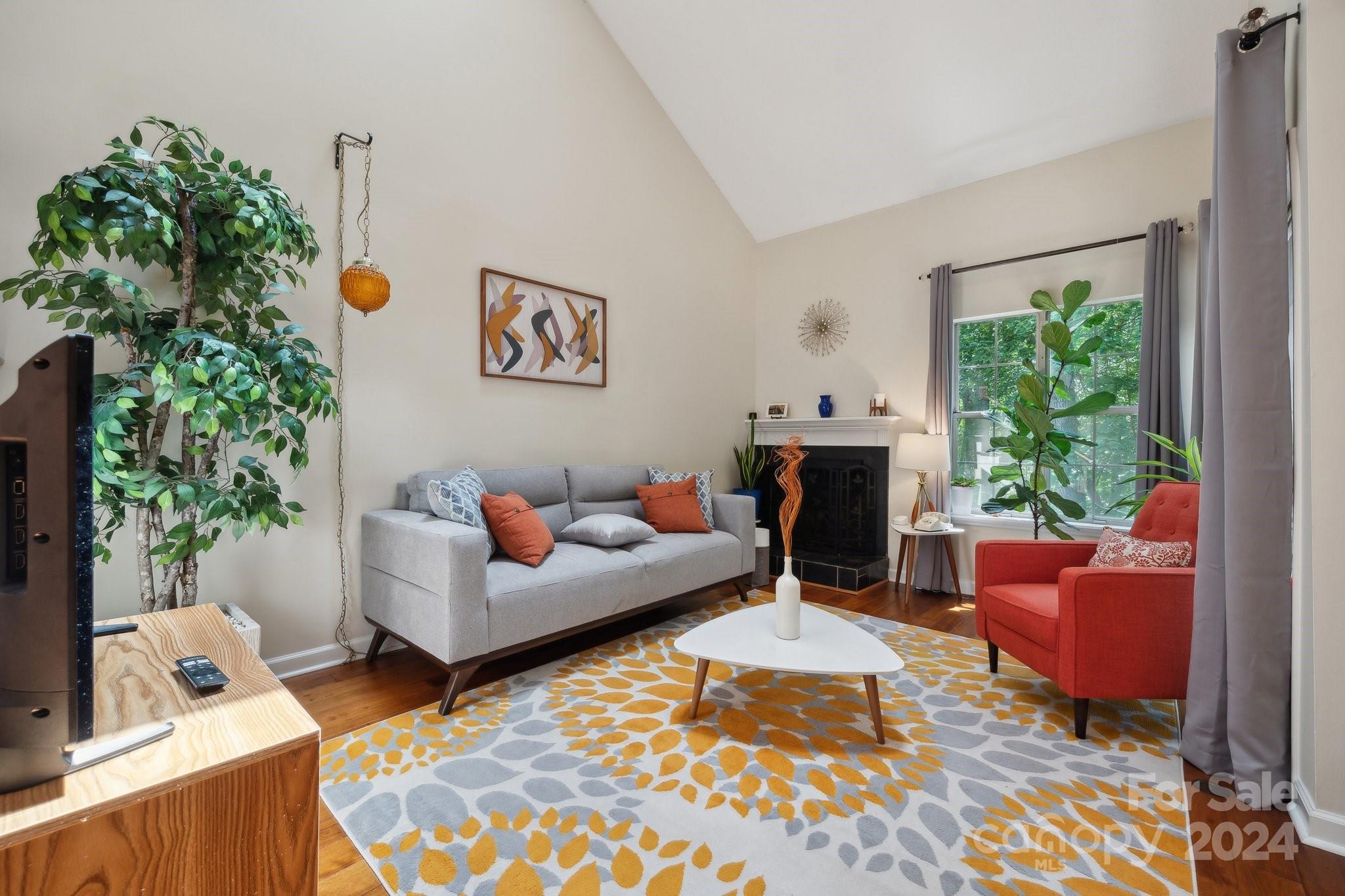 9012 St Thomas Lane Charlotte, NC 28277 - Photo 2 of 25 a living room with furniture and a fireplace