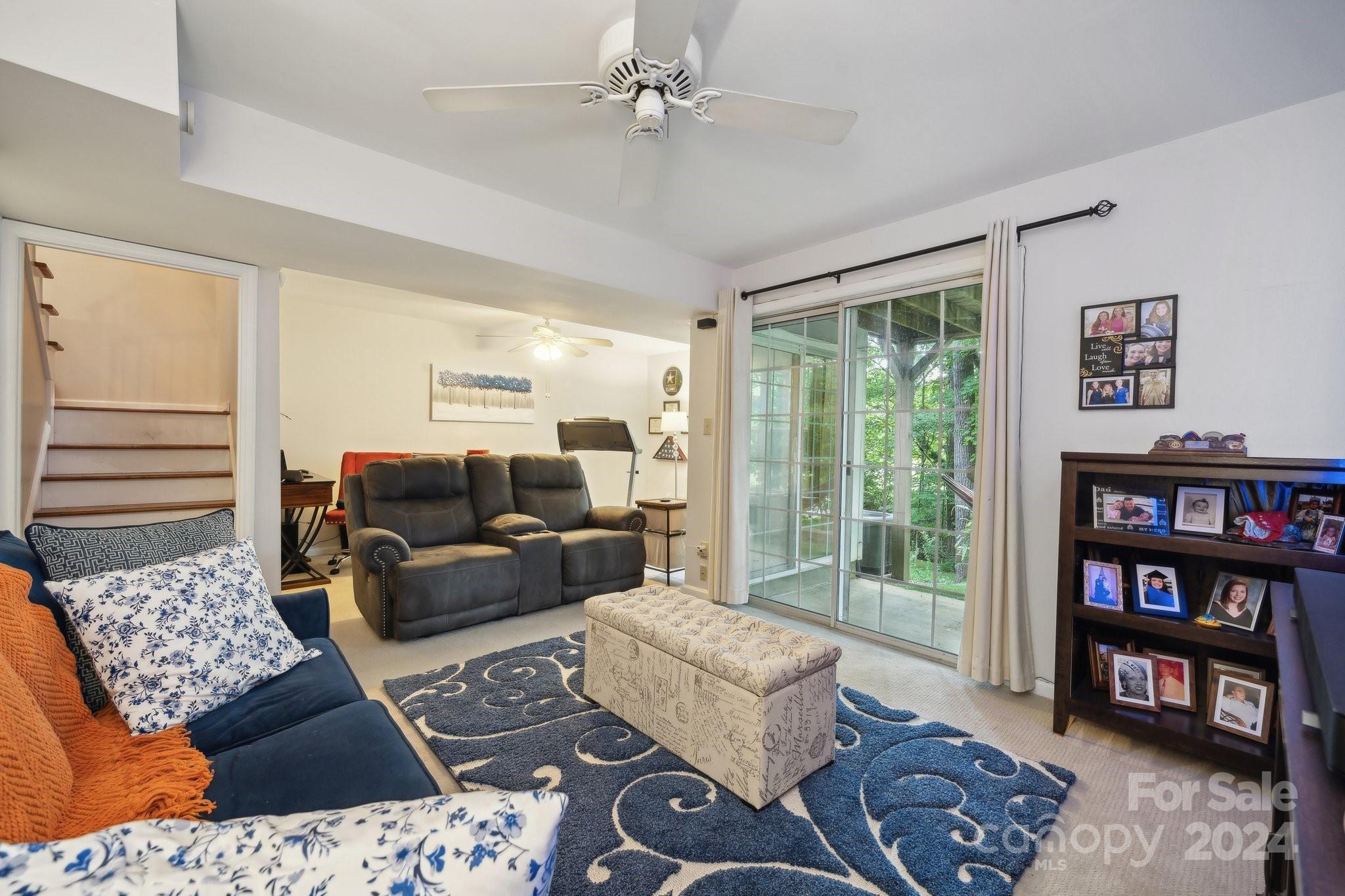 9012 St Thomas Lane Charlotte, NC 28277 - Photo 21 of 25 a living room with furniture and a book shelf
